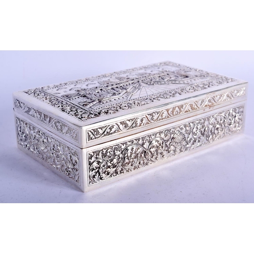 903 - A THAI WHITE METAL BOX EMBOSSED WITH A TEMPLE SCENT.  16.5cm long, 10cm wide and 5cm high