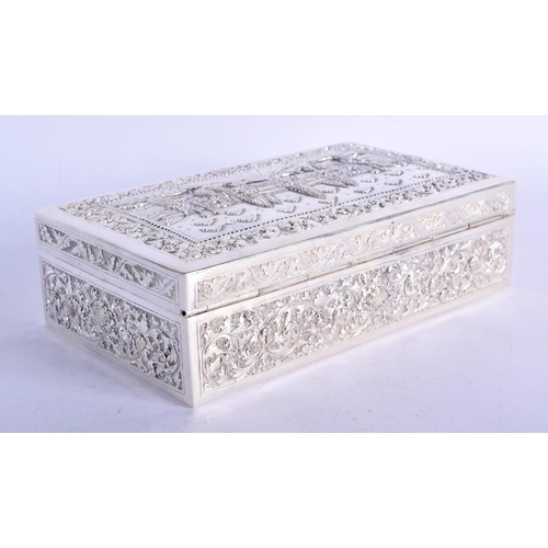 903 - A THAI WHITE METAL BOX EMBOSSED WITH A TEMPLE SCENT.  16.5cm long, 10cm wide and 5cm high