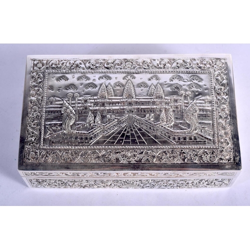 903 - A THAI WHITE METAL BOX EMBOSSED WITH A TEMPLE SCENT.  16.5cm long, 10cm wide and 5cm high