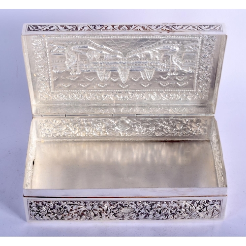 903 - A THAI WHITE METAL BOX EMBOSSED WITH A TEMPLE SCENT.  16.5cm long, 10cm wide and 5cm high