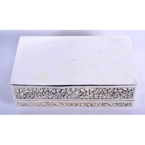 903 - A THAI WHITE METAL BOX EMBOSSED WITH A TEMPLE SCENT.  16.5cm long, 10cm wide and 5cm high