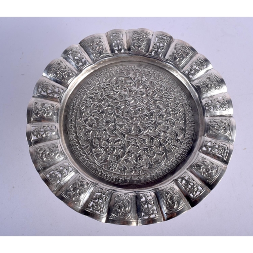 905 - AN INDIAN SILVER HEAVILY EMBOSSED TAZZA.  19.5cm diameter, 8cm high, weight 263g