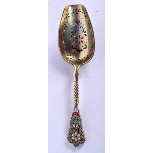 913 - A CONTINENTAL ENAMEL, SILVER GILT AND PLIQUE A JOUR CADDY SPOON.  11.7 long, weight 41g