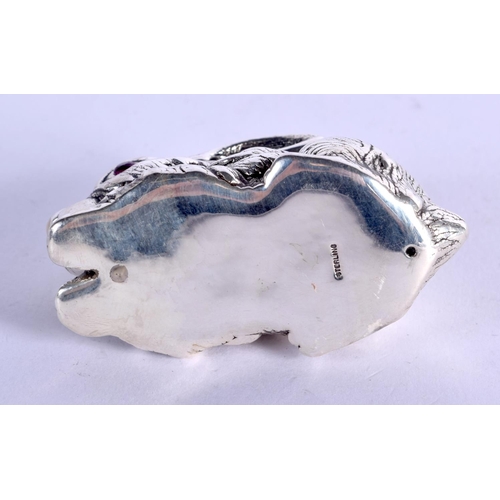 916 - A STERLING SILVER RABBIT WITH GEM SET EYES.  2.9cm x 5.5cm x 2.6cm, weight 27.6g