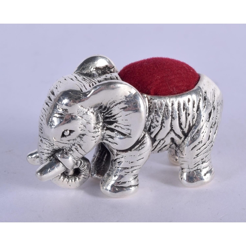 918 - A STERLING SILVER PIN CUSHION IN THE FORM OF AN ELEPHANT.  4.1cm x 2.5cm, weight 14.5g