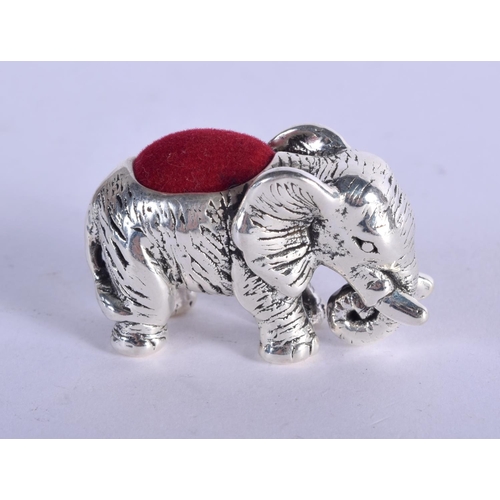 918 - A STERLING SILVER PIN CUSHION IN THE FORM OF AN ELEPHANT.  4.1cm x 2.5cm, weight 14.5g