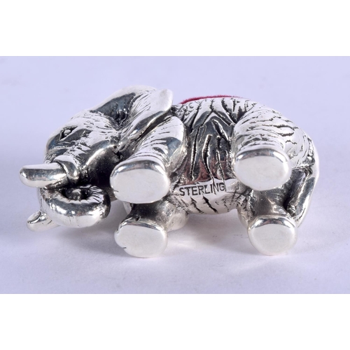 918 - A STERLING SILVER PIN CUSHION IN THE FORM OF AN ELEPHANT.  4.1cm x 2.5cm, weight 14.5g