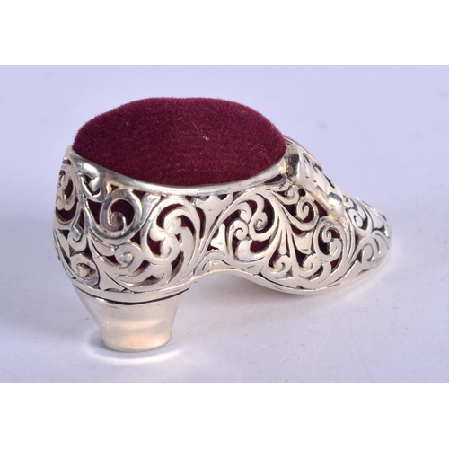 919 - A SILVER PLATED PIN CUSHION IN THE FORM OF A SHOE WITH A GEM INSET.  5.1cm x 2.8cm, weight 19.7g