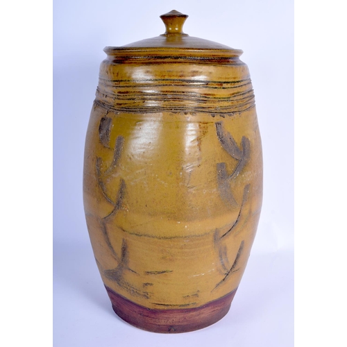 93 - A LARGE VINTAGE STUDIO POTTERY STONEWARE VASE AND COVER with scrafito decoration. 47 cm x 20 cm.