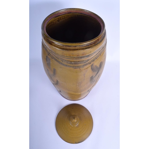 93 - A LARGE VINTAGE STUDIO POTTERY STONEWARE VASE AND COVER with scrafito decoration. 47 cm x 20 cm.