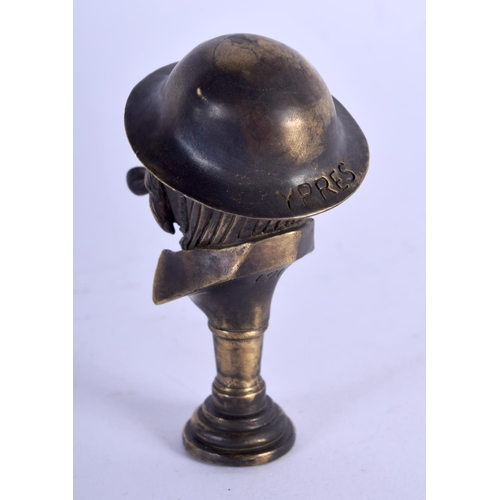 933 - A PIPE TAMPER IN FORM OF A WW1 SOLDIER SMOKING A PIPE.  6.3cm x 3.5cm, weight 51.8g