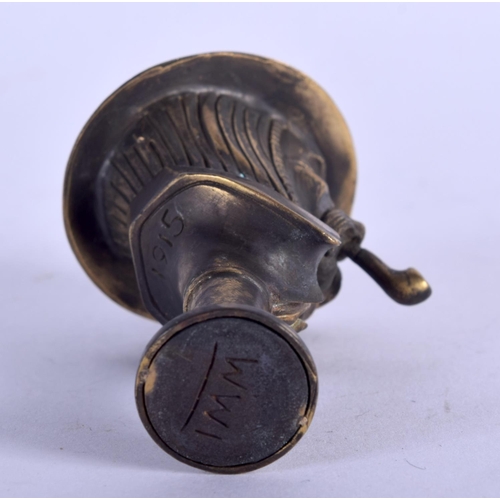 933 - A PIPE TAMPER IN FORM OF A WW1 SOLDIER SMOKING A PIPE.  6.3cm x 3.5cm, weight 51.8g