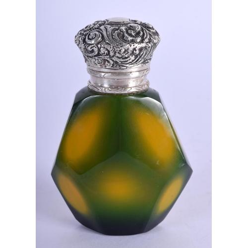 939 - A SILVER TOPPED GLASS SCENT BOTTLE.  7.4cm x .7cm. Weight 81g