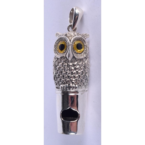 940 - A STERLING SILVER OWL WHISTLE WITH GEM INSET EYES.  Stamped 925 Sterling, 5.3cm x 1.4cm, weight 18.7... 