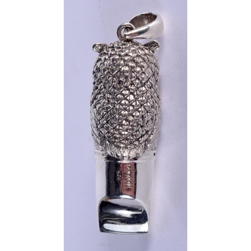 940 - A STERLING SILVER OWL WHISTLE WITH GEM INSET EYES.  Stamped 925 Sterling, 5.3cm x 1.4cm, weight 18.7... 