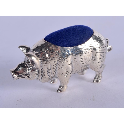 947 - A STERLING SILVER PIN CUSHION IN THE FORM OF A PIG.  4.2cm x 2.3cm, weight 16.2g