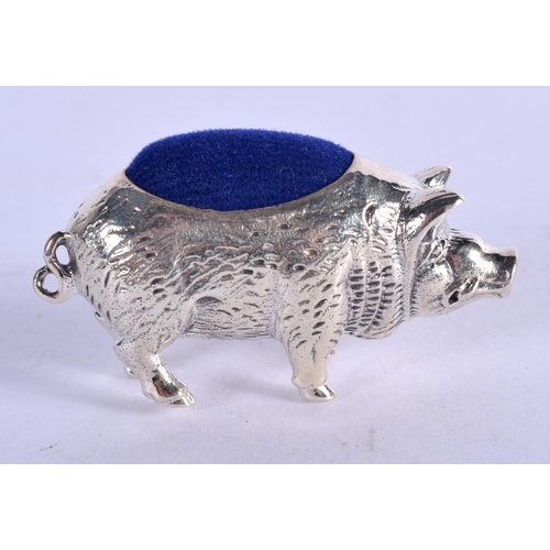 947 - A STERLING SILVER PIN CUSHION IN THE FORM OF A PIG.  4.2cm x 2.3cm, weight 16.2g