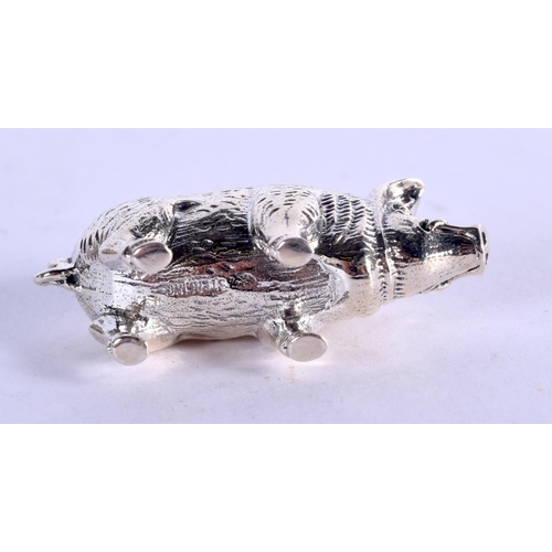 947 - A STERLING SILVER PIN CUSHION IN THE FORM OF A PIG.  4.2cm x 2.3cm, weight 16.2g