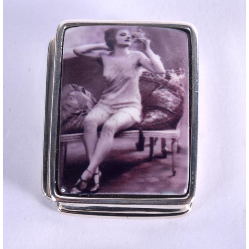 948 - A STERLING SILVER AND ENAMEL PILL BOX DECORATED WITH A SCANTILY CLAD FEMALE.  3.2cm x 2.6cm, weight ... 