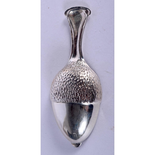 957 - A SILVER ACORN SHAPED CADDY SPOON.  Stamped 925, 8.4cm x 3.3cm weight 11.7g