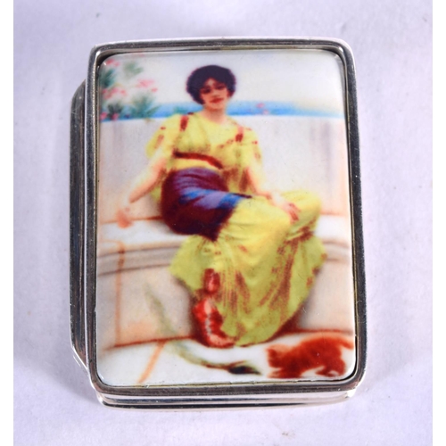 960 - A SILVER AND ENAMEL PILL BOX DECORATED WITH A FEMALE IN A YELLOW DRESS.  3.1cm x 2.5cm, weight 15.9g