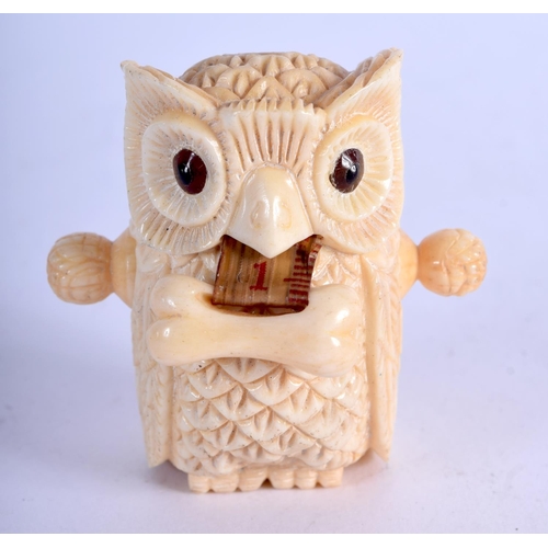 962 - A BONE TAPE MEASURE IN THE FORM OF AN OWL.  5.4cm x 5.2cm, weight 55.4g