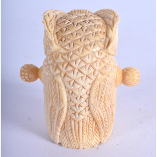 962 - A BONE TAPE MEASURE IN THE FORM OF AN OWL.  5.4cm x 5.2cm, weight 55.4g