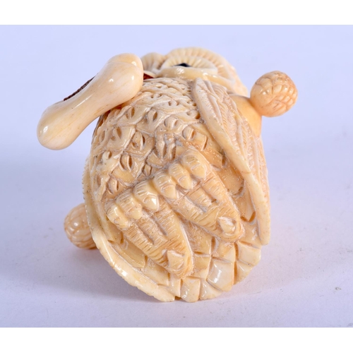 962 - A BONE TAPE MEASURE IN THE FORM OF AN OWL.  5.4cm x 5.2cm, weight 55.4g