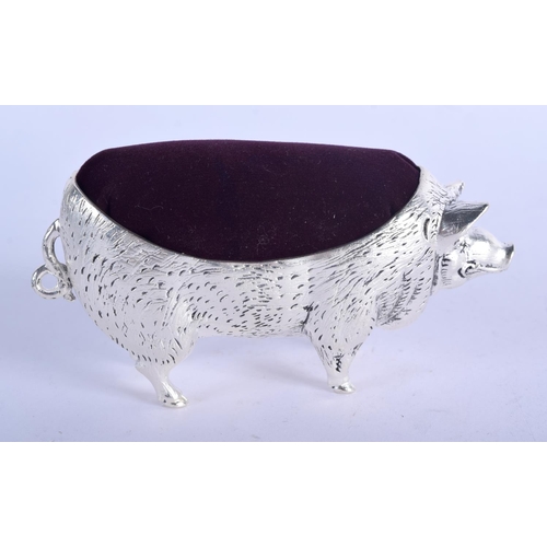 963 - A CONTINENTAL SILVER PIG PIN CUSHION.  Stamped 800, 10.7cm x 5.8cm, weight 129.4g