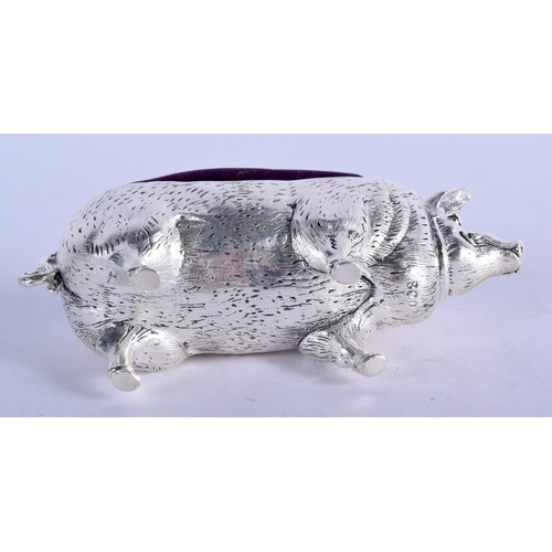 963 - A CONTINENTAL SILVER PIG PIN CUSHION.  Stamped 800, 10.7cm x 5.8cm, weight 129.4g