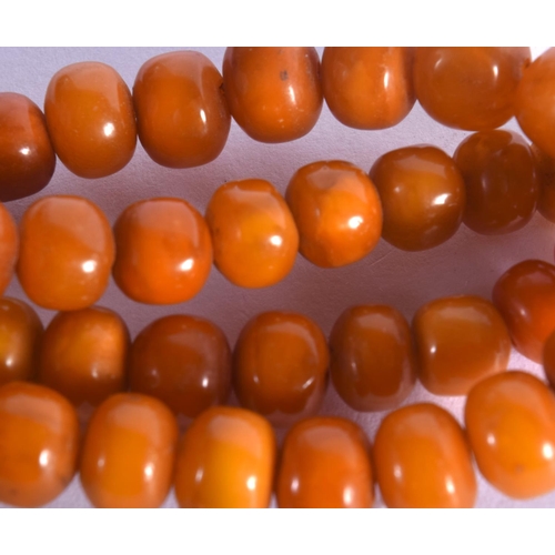 998 - AN AMBER NECKLACE.  44cm Long, Largest bead 10.3mm,  weight 25g