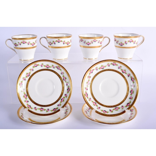 196 - A set of four 20th Century Minton cups and saucers, with pink roses border. (8)