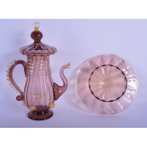 32 - AN EARLY 20TH CENTRY ITALIAN VENETIAN AUBERGINE GLASS EWER AND COVER upon a matching stand. 28 cm x ... 