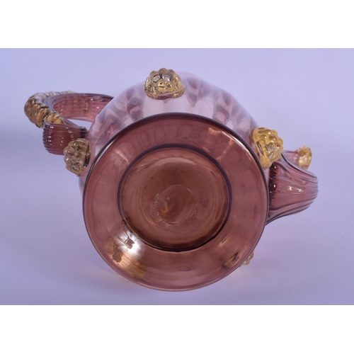 32 - AN EARLY 20TH CENTRY ITALIAN VENETIAN AUBERGINE GLASS EWER AND COVER upon a matching stand. 28 cm x ... 