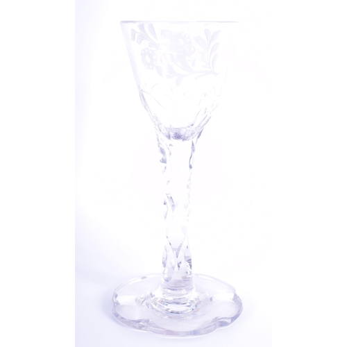 8 - A GEORGE III GLASS engraved with insects and flowers. 15 cm high.