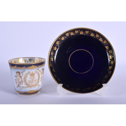109 - SEVRES COFFEE CUP AND SAUCER PAINTED WITH TWO WINGED CHERUBS A CROWN AND INITIALS LP FOR LOUIS PHILL... 