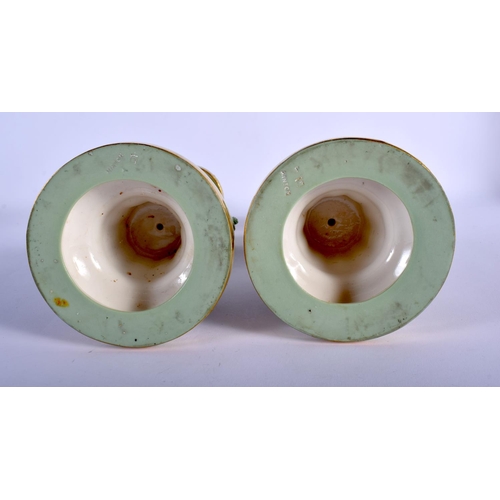 113 - MINTON PAIR OF SEVRES STYLE CHERUB CELADON CANDLESTICKS WITH GILT HIGHLIGHTS C.1880.24cm high (Pr)