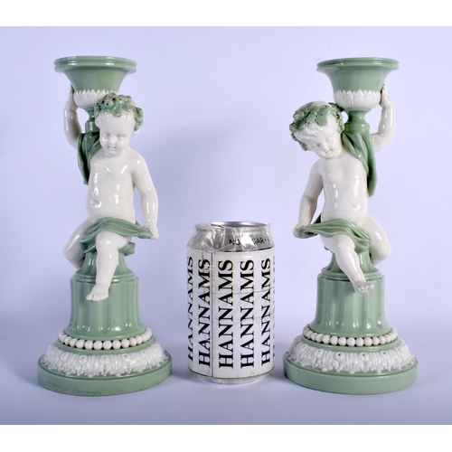 114 - MINTON PAIR OF SEVRES STYLE CHERUB CELADON CANDLESTICKS C.1880. 23.5cm high (Pr)
