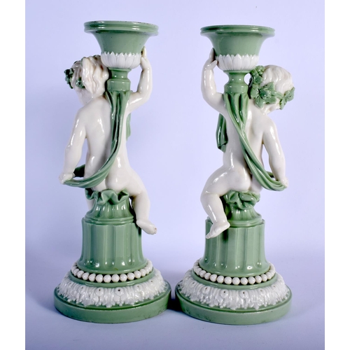 114 - MINTON PAIR OF SEVRES STYLE CHERUB CELADON CANDLESTICKS C.1880. 23.5cm high (Pr)