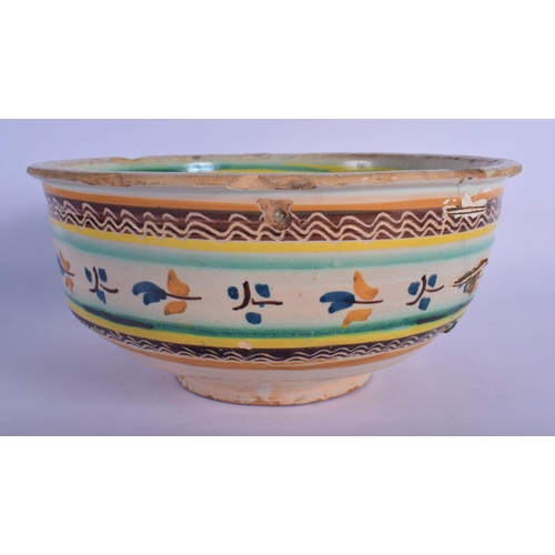 16 - A 17TH/18TH CENTURY SOUTH EUROPEAN FAIENCE GLAZED BOWL painted with sparse foliage. 24 cm x 12 cm.
