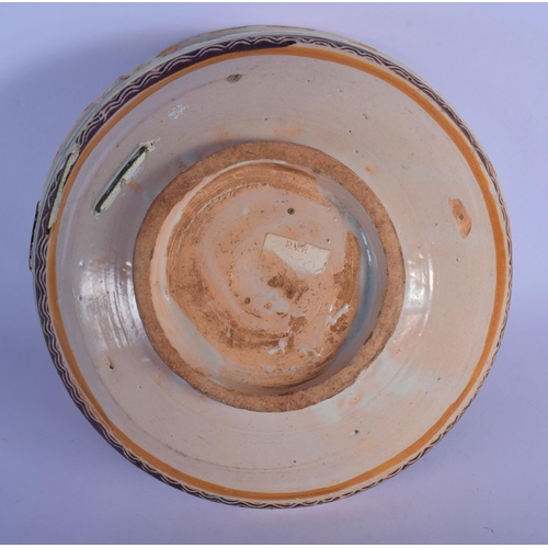 16 - A 17TH/18TH CENTURY SOUTH EUROPEAN FAIENCE GLAZED BOWL painted with sparse foliage. 24 cm x 12 cm.