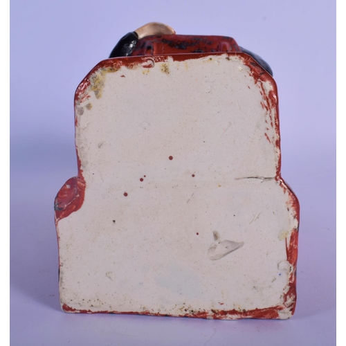 22 - AN EARLY 19TH CENTURY ENGLISH PEARLWARE FIGURE OF THE SLEEPING JUDGE in the manner of Ralph Wood. 25... 