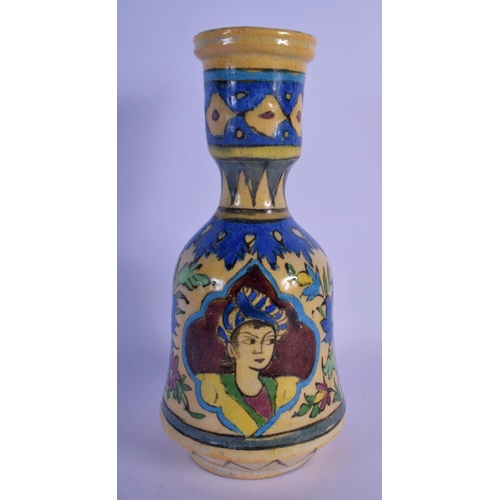 23 - A MIDDLE EASTERN PERSIAN FAIENCE GLAZED HOOKAH PIPE VASE painted with portraits. 28 cm high.