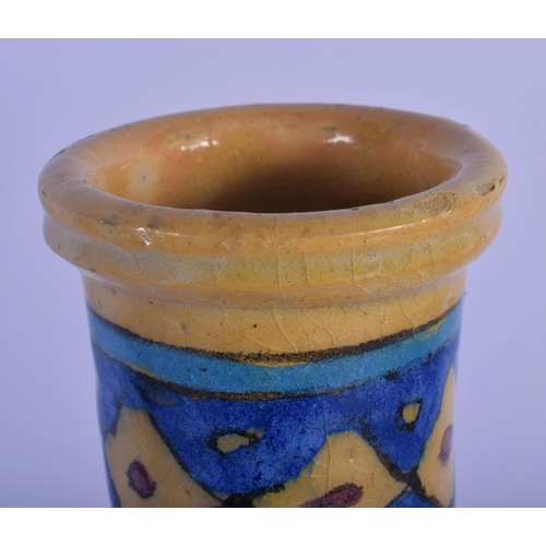 23 - A MIDDLE EASTERN PERSIAN FAIENCE GLAZED HOOKAH PIPE VASE painted with portraits. 28 cm high.