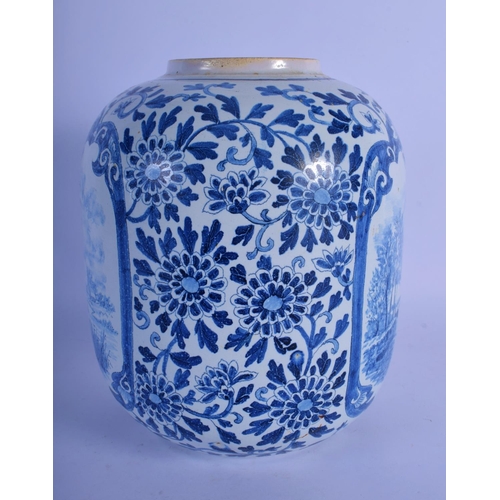 25 - A DUTCH DELFT BLUE AND WHITE GLOBULAR VASE painted with boats within panels of flowers. 22 cm x 13 c... 