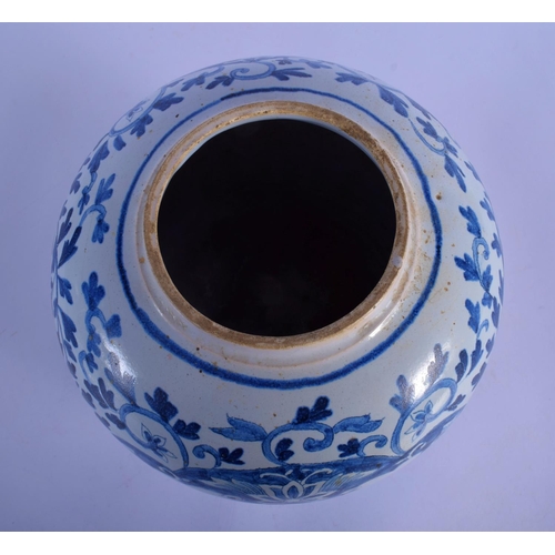 25 - A DUTCH DELFT BLUE AND WHITE GLOBULAR VASE painted with boats within panels of flowers. 22 cm x 13 c... 