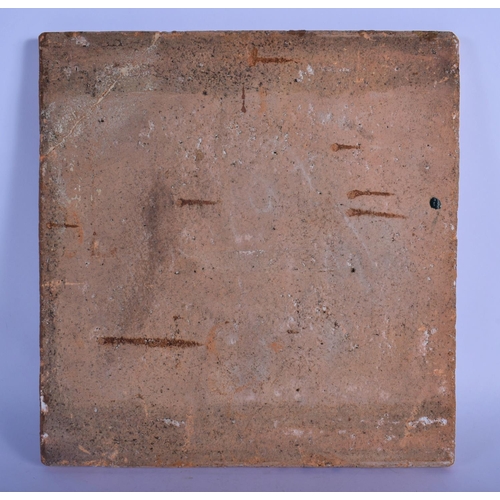 27 - A LARGE 19TH CENTURY FRENCH FAIENCE ENAMELLED POTTERY TILE depicting figures within an interior. 30 ... 