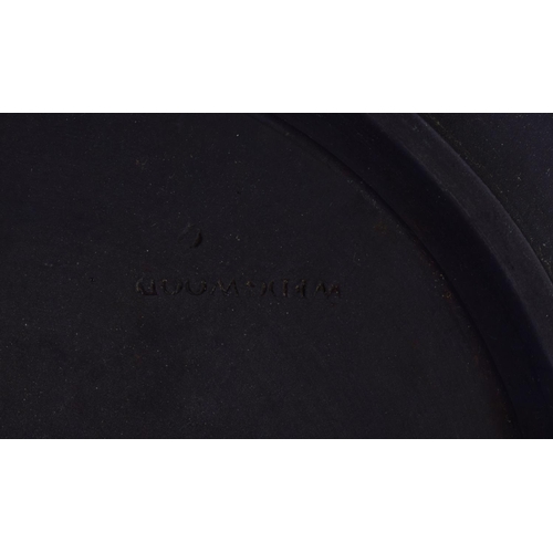 29 - A WEDGWOOD BLACK BASALT SHALLOW BOWL. 23.5 cm diameter.