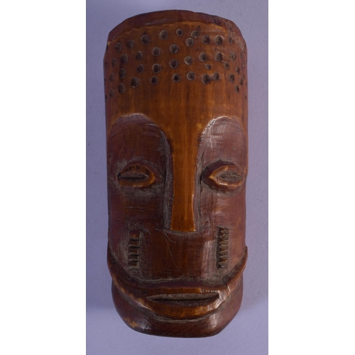 300 - AN EARLY 20TH CENTURY AFRICAN CARVED TRIBAL MASK with sparse decoration. 12 cm x 5 cm.