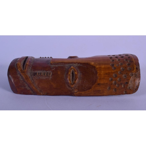 300 - AN EARLY 20TH CENTURY AFRICAN CARVED TRIBAL MASK with sparse decoration. 12 cm x 5 cm.